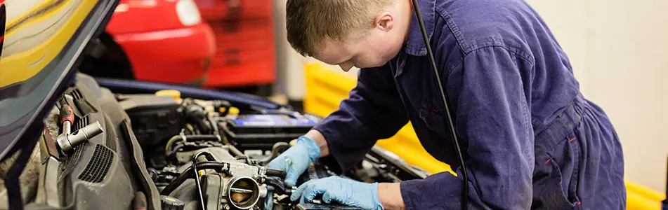 mechanic fixing an engine